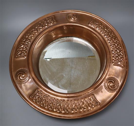 An Arts and Crafts port hole mirror, in the John Pearson Style diameter 45cm